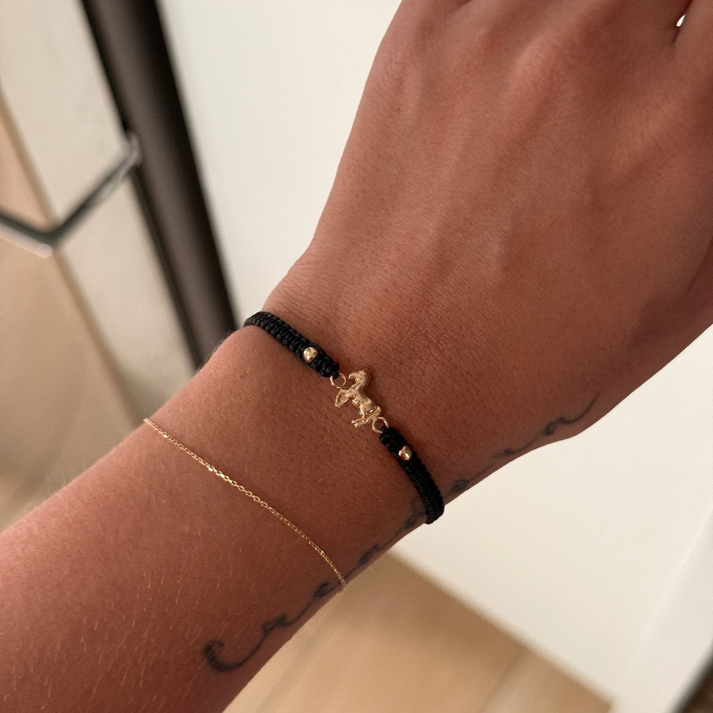BLACK THREAD BRACELET WITH HORSE FITTINGS + 2 3M 18K YELLOW GOLD BALLS 0.6GR