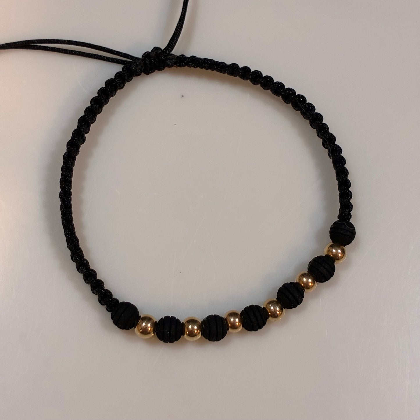 BLACK THREAD BRACELET WITH 6 SMOOTH 4MM BEADS IN 18K YELLOW GOLD - 0.54GR