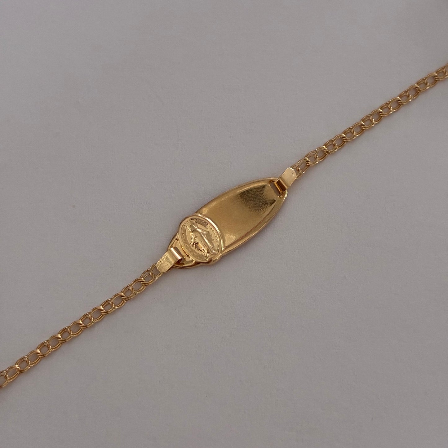 BABY BRACELET WITH OVAL PLAQUE WITH MIRACULOUS VIRGIN, FOLLOWED RING, 18K YELLOW GOLD, 13CM - 1.23GR