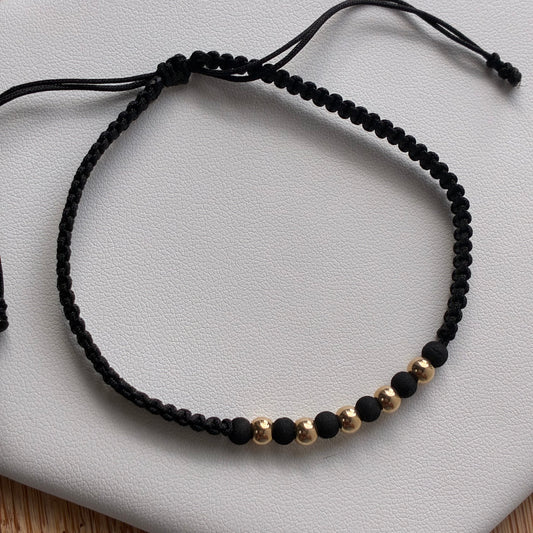 PULSERA HILO NEGRO 5 BOLAS LISAS 4M ORO AMARILLO 18K - 0,45GR