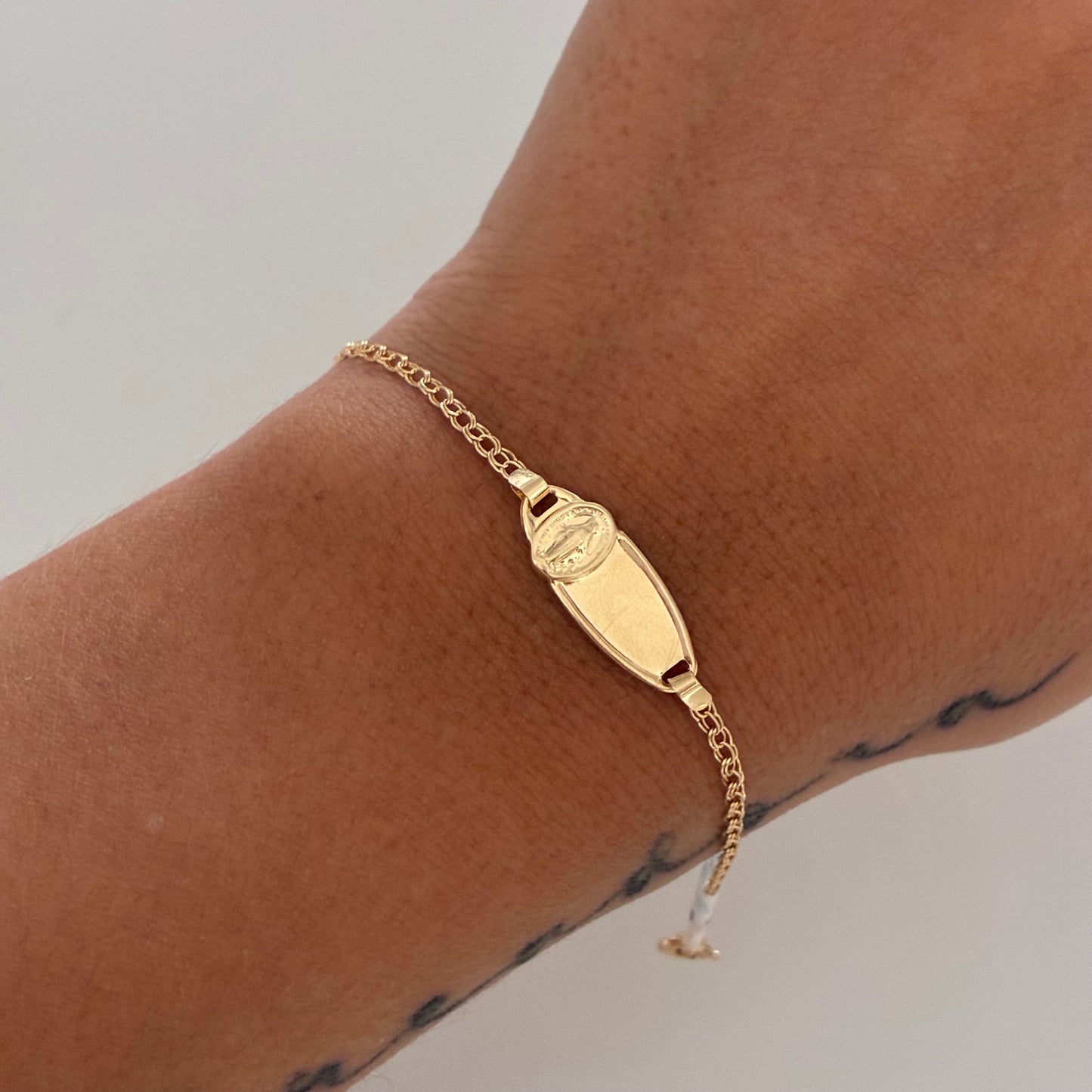 BABY BRACELET WITH OVAL PLAQUE WITH MIRACULOUS VIRGIN, FOLLOWED RING, 18K YELLOW GOLD, 13CM - 1.23GR