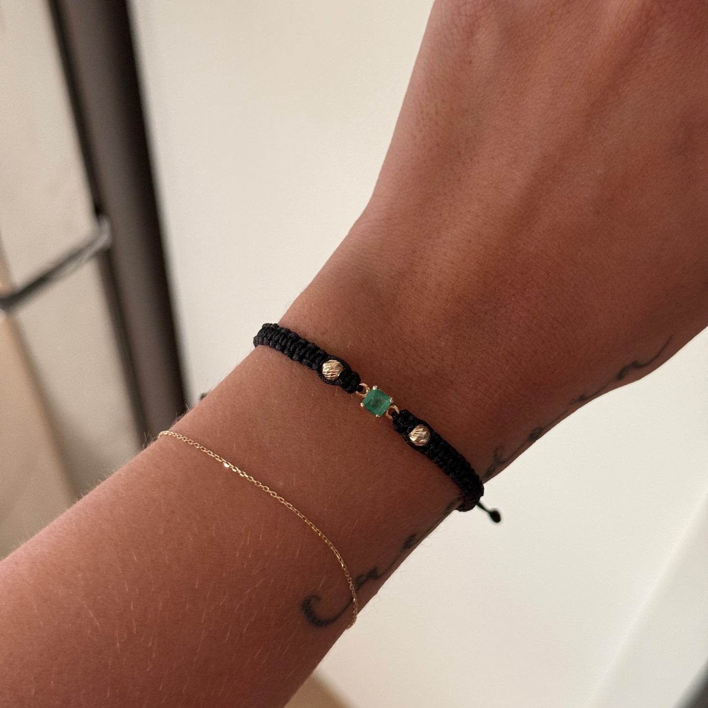 BLACK THREAD BRACELET WITH NATURAL EMERALD HARDWARE + 2 4M 18K YELLOW GOLD BALLS 0.95GR