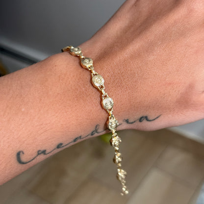 PULSO RUSTICO DIAMANTADO SIMBOLOS 6MM ORO AMARILLO 18K 19CM - 5,06GR