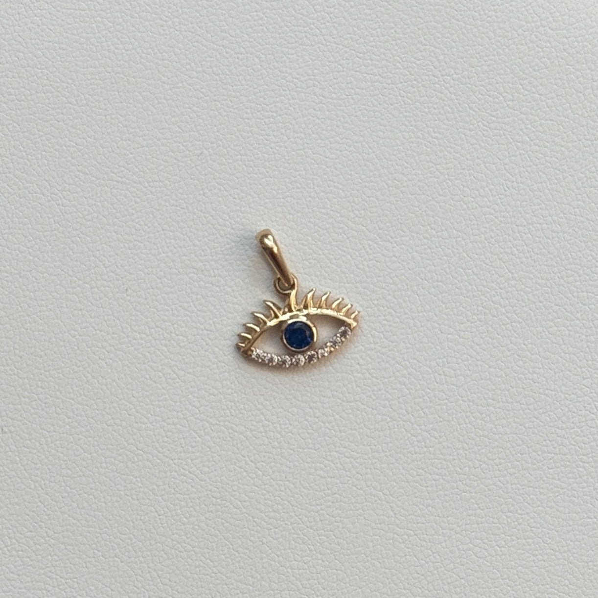 DIJE OJO TURCO SILUETA CIRCON AZUL Y BLANCO 1.4CM ORO AMARILLO ITALY ESP 18K - 0,76GR