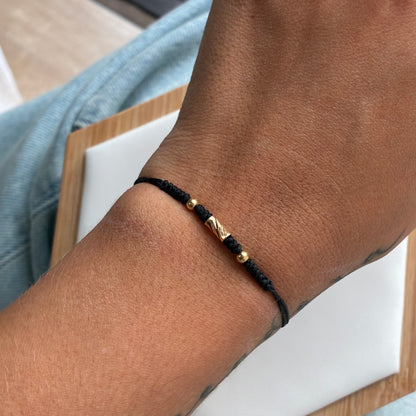 PULSERA HILO NEGRO 1 CILINDRO + 2 BOLAS LISAS 3M ORO AMARILLO 18K - 0,25GR