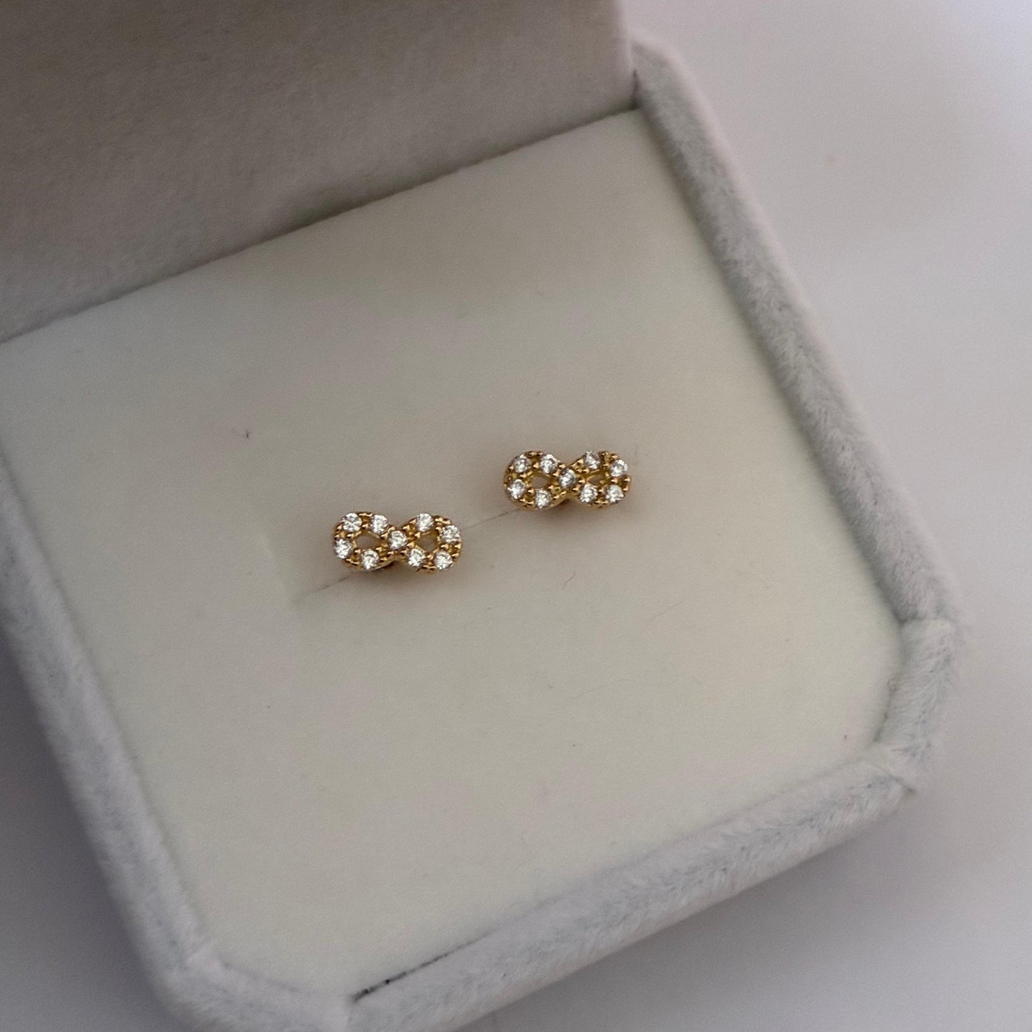 INFINITY STUDS WITH WHITE STONES YELLOW GOLD COL 18K - 0.85GR