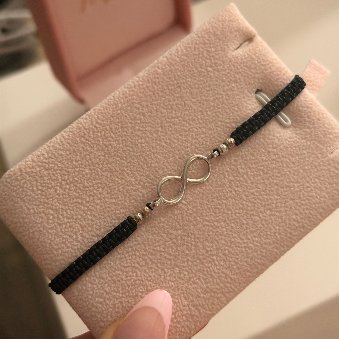 PULSERA HILO NEGRO HERRAJE INFINITO + 4 BOLAS DIAMANTADAS 3MM ORO BLANCO COL 18K - 0,65GR